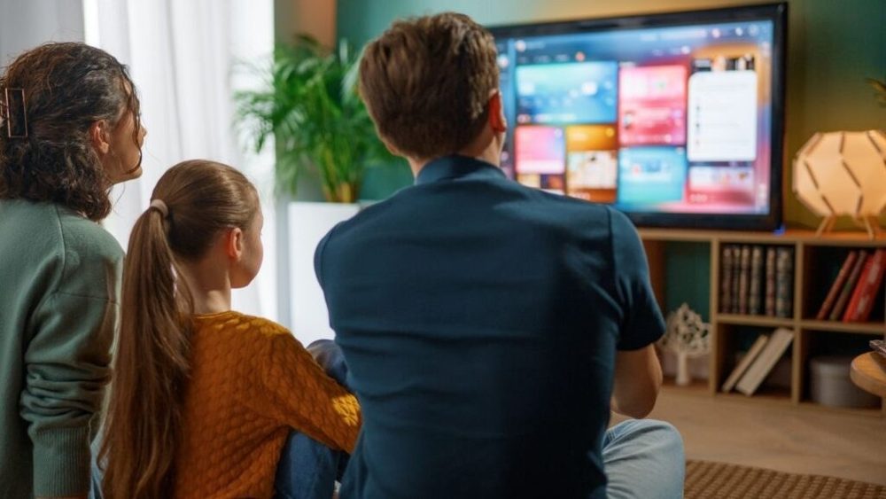 Family enjoying cable TV at home