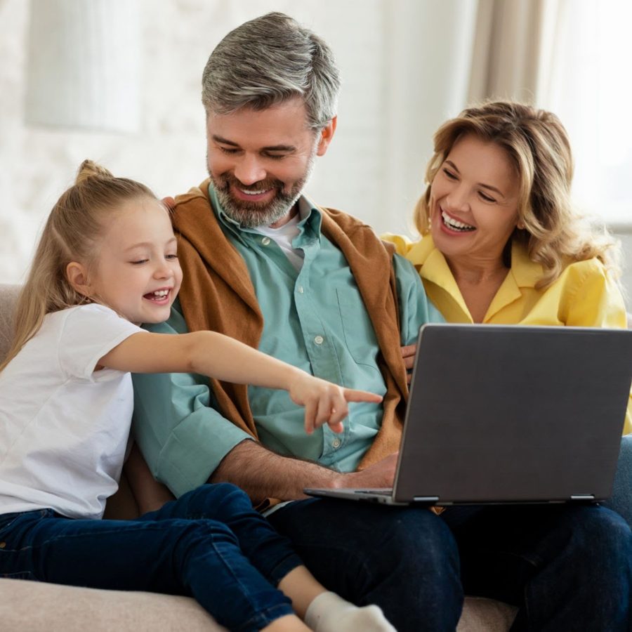 Family comparing internet plans on a laptop at home